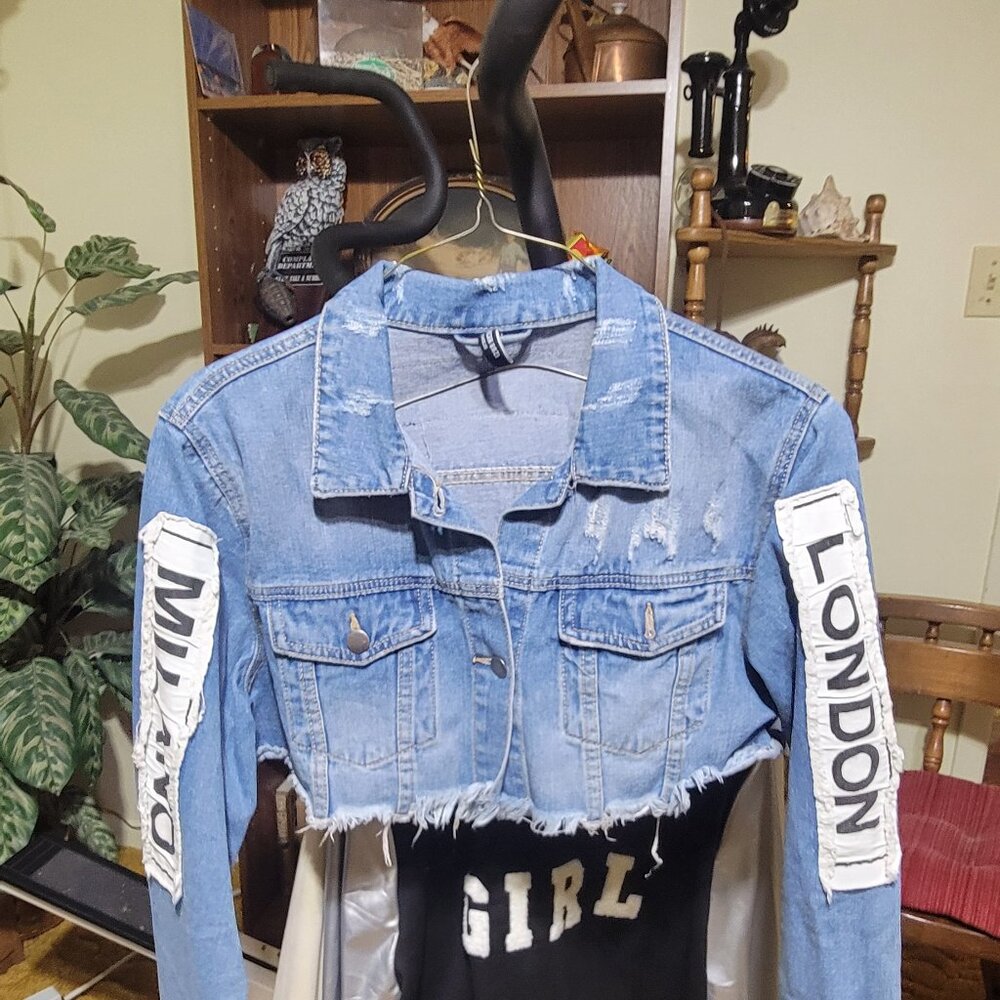 Cropped jeans jacket with high fashion logos